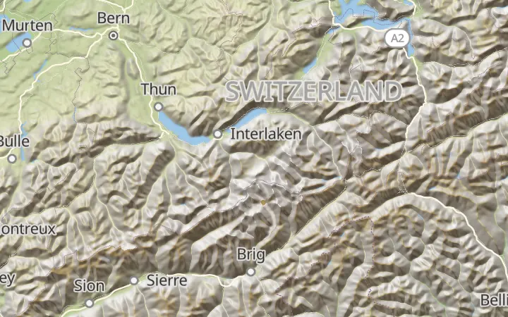 The relief style over Switzerland: green lowlands, brown and grey mountains, lakes